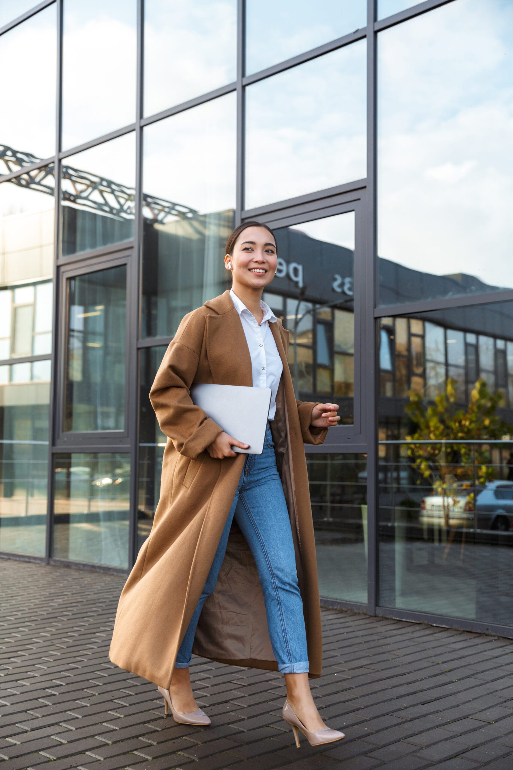 Image,Of,Young,Brunette,Asian,Woman,Wearing,Earbuds,Holding,Laptop careers banner